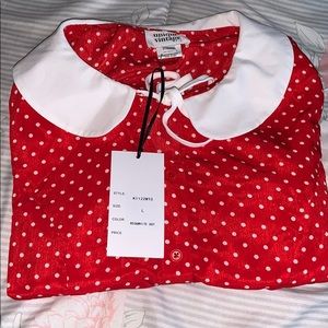 Red and white polka dot shirt.